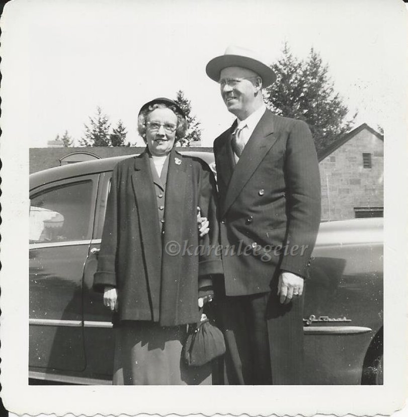 haggie_Lalla and Ed standing next to car_1950s